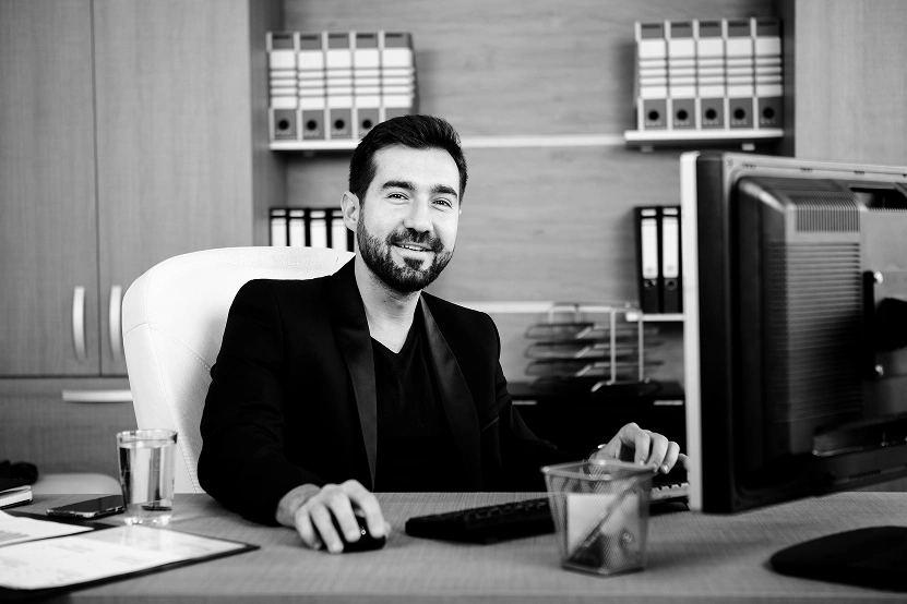 smiling-businessman-working-his-office-businessperson-professional-environment